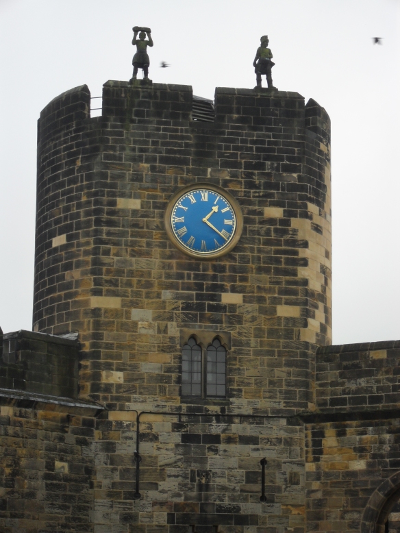 The beautiful blue of the clock on the Alnwick tower stands out on a rainy day